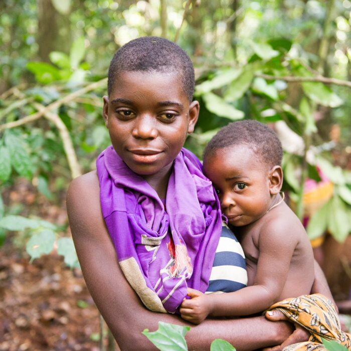 Mother & child in Africa's rainforest. Photo by Max Chiswick.