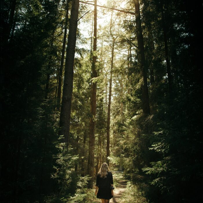 Woman in the forest, Sweden. Photo by Geran DeKlerk.