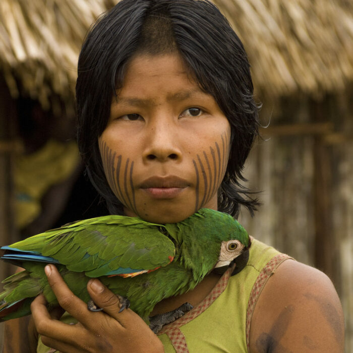 Kayapo girl with parrot/Photo by Cristina Mittermeier